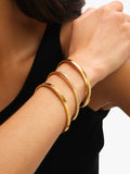 Jon Richard waterproof polished crystal bangle in gold, UK version