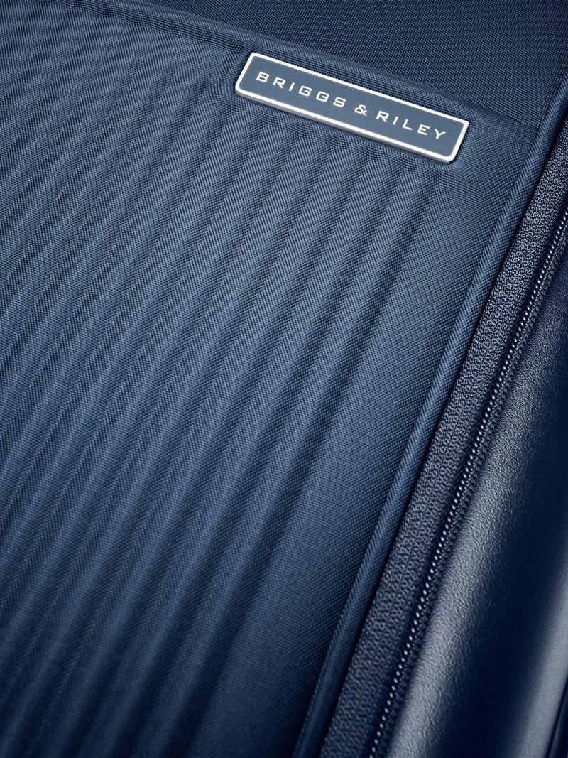 Briggs & Riley navy carry-on spinner suitcase 56cm, imported from the UK