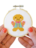 The Make Arcade gingerbread man mini cross stitch kit, UK version