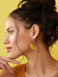 Ottoman Hands feather hoop earrings in gold - British product