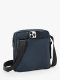 TUMI Junior crossbody bag navy coated canvas, UK version