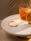 Orelia open wave bangle in gold - British product