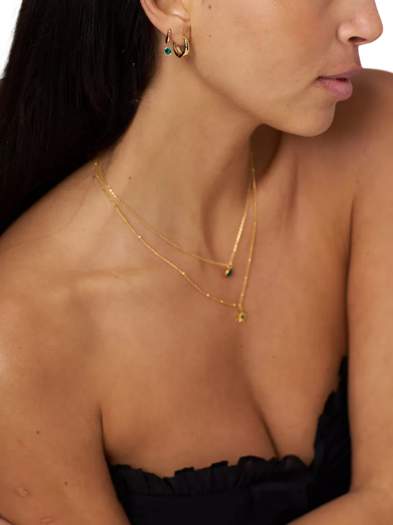 Orelia Swarovski huggie hoop earrings gold emerald - British product