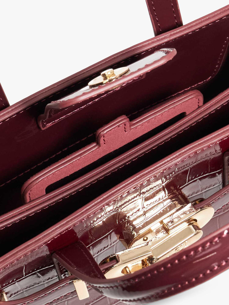 Dune London burgundy leather grab bag with belted detail, imported from the UK