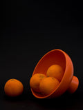 raawii Strøm medium earthenware footed serve bowl 19cm vibrant orange, UK version