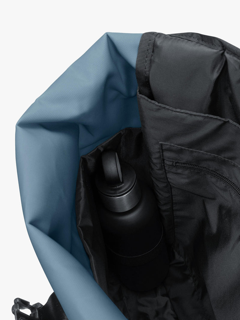 Eastpak roll top 16in backpack 23L tarp dust blue (British brand)