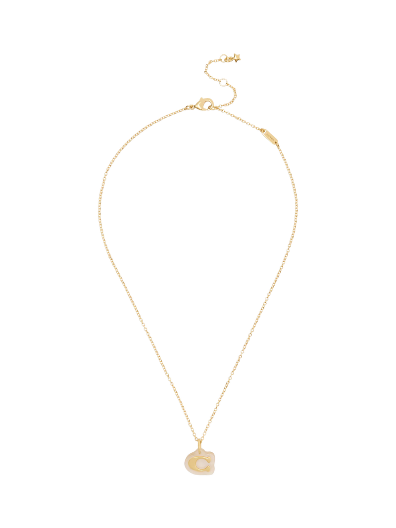 Coach gold pendant necklace with lucite and cubic zirconia, imported from the UK