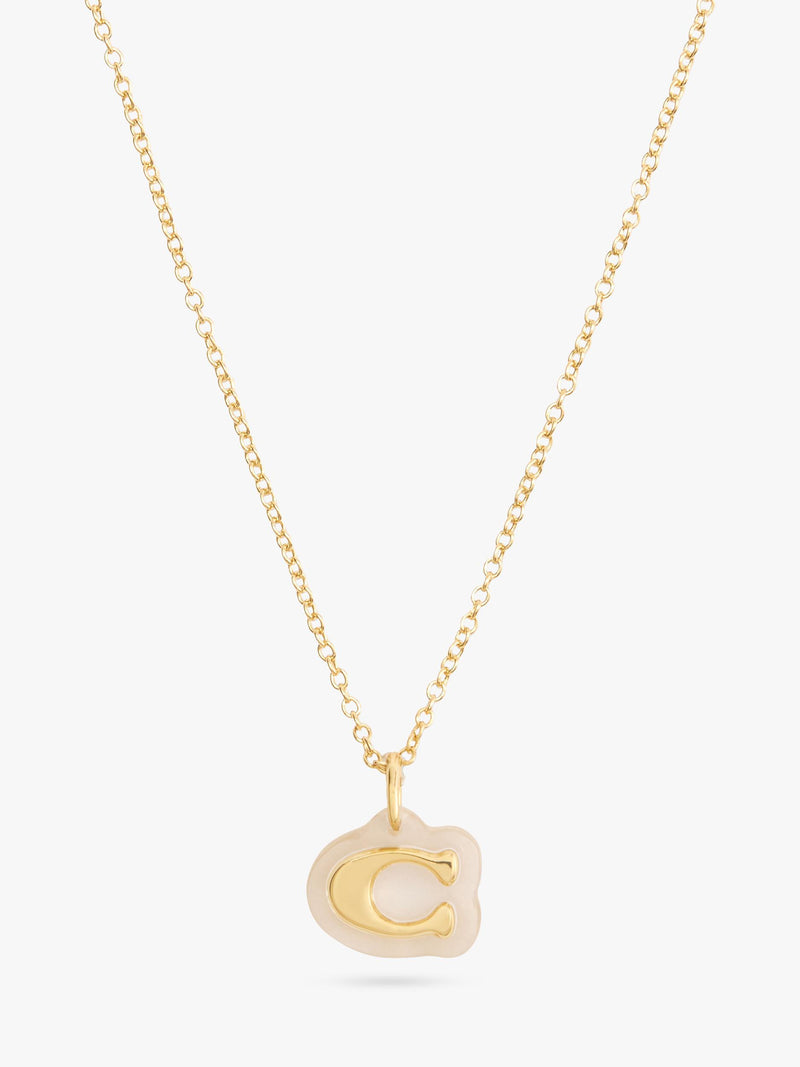 Coach gold pendant necklace with lucite and cubic zirconia, imported from the UK