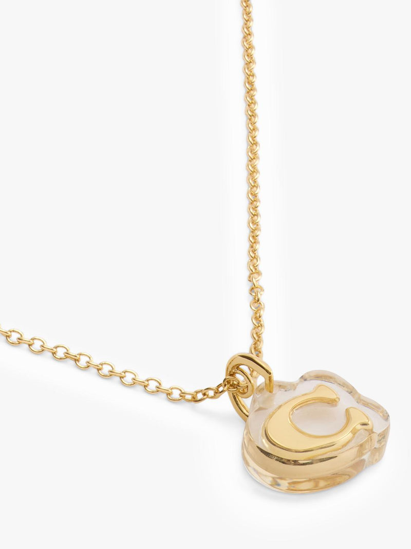 Coach gold pendant necklace with lucite and cubic zirconia, imported from the UK