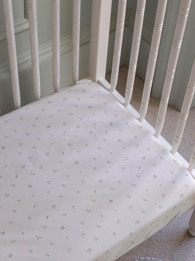 Avery Row cotbed fitted sheet nettle scatter pattern imported from the UK