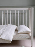 Avery Row cotbed fitted sheet nettle scatter pattern imported from the UK