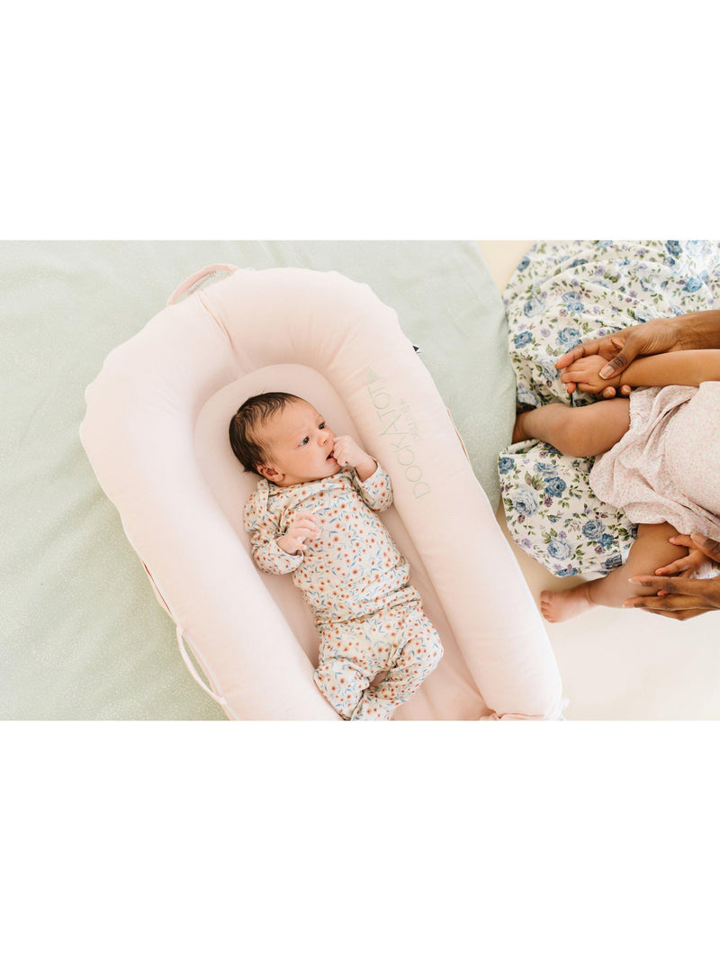 DockATot Deluxe+ pink baby pod - British product