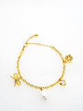 Ted Baker gold tone charm bracelet, imported from the UK