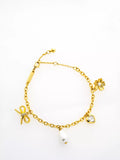 Ted Baker gold tone charm bracelet, imported from the UK