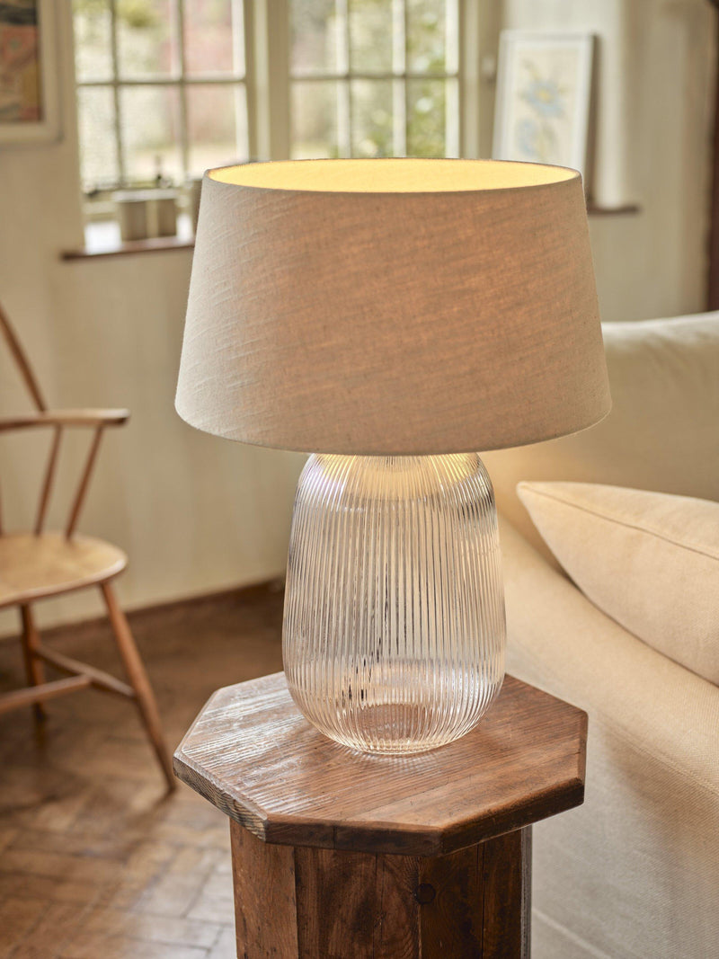 Neptune Malton glass pillar table lamp bronze with linen shade, UK version