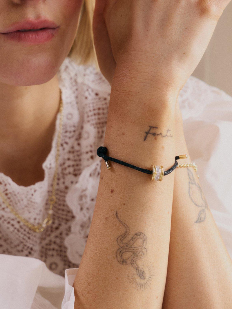 Daisy London crystal bead bracelet black cord gold, UK version