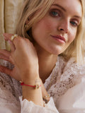 Daisy London red cord crystal bead bracelet with gold plating, imported from the UK