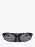 Oakley OO9437 tinted oval sunglasses, imported from the UK