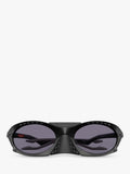 Oakley OO9437 tinted oval sunglasses, imported from the UK