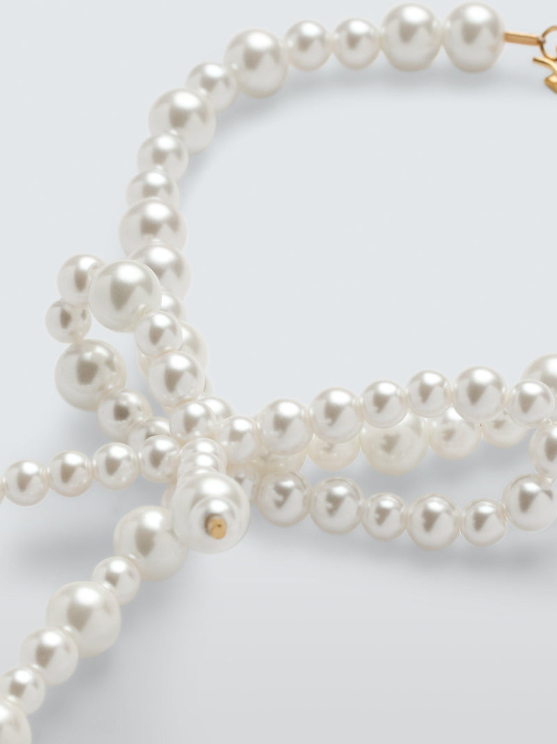 Completedworks glass pearl bow bracelet gold, UK version