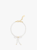 Coach pearl bow bracelet with gold tone accents, UK version