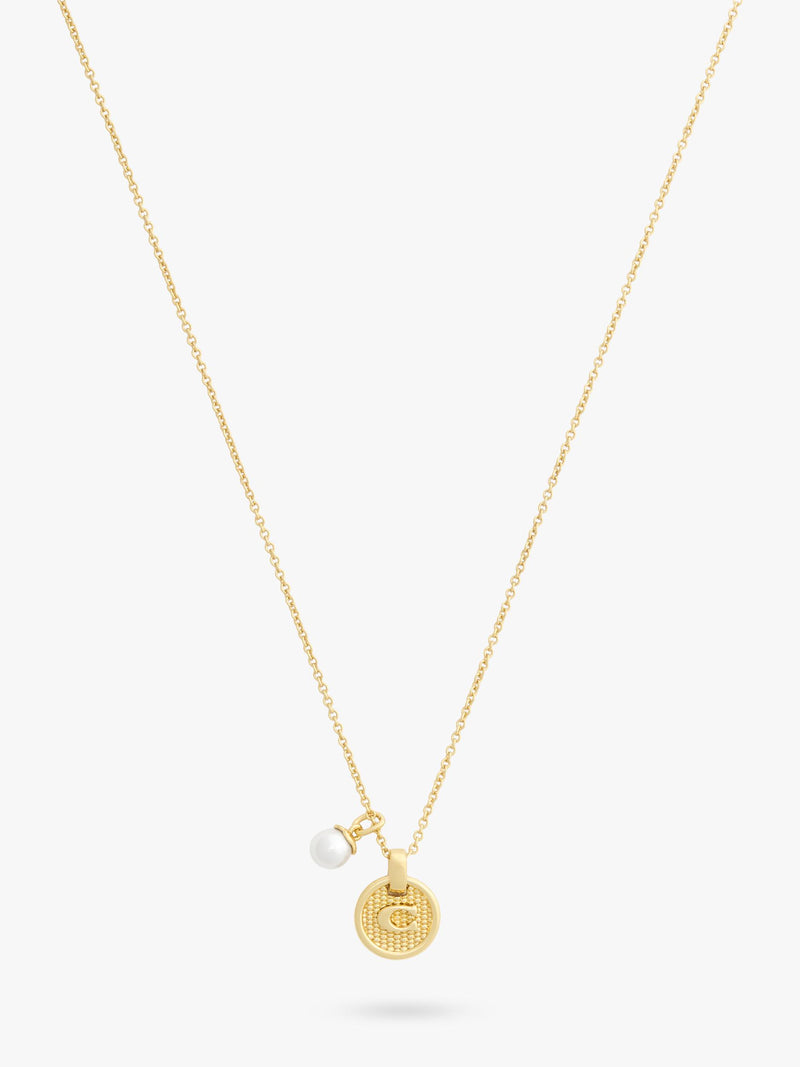 Coach gold-toned disc pendant necklace imported from the UK