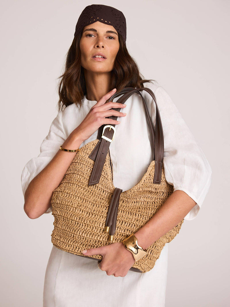 Mint Velvet woven bucket bag in Natural, imported from the UK