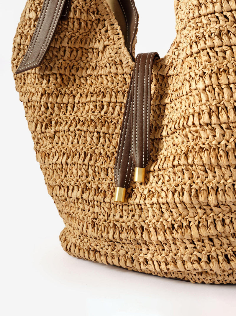 Mint Velvet woven bucket bag in Natural, imported from the UK