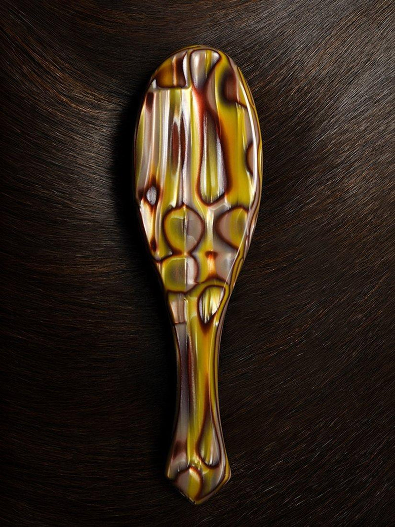 Oribe flat hair brush with Italian resin handle, imported from the UK