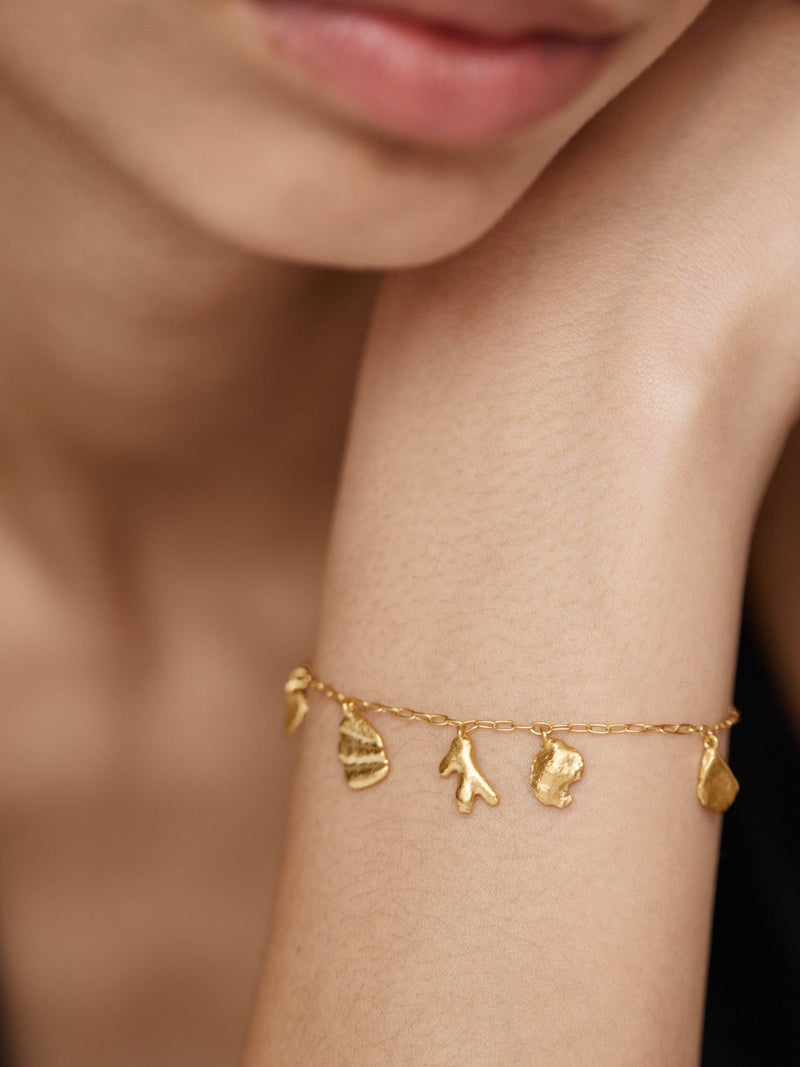 Monica Vinader gold shell charm bracelet, imported from the UK