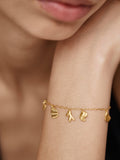 Monica Vinader gold shell charm bracelet, imported from the UK