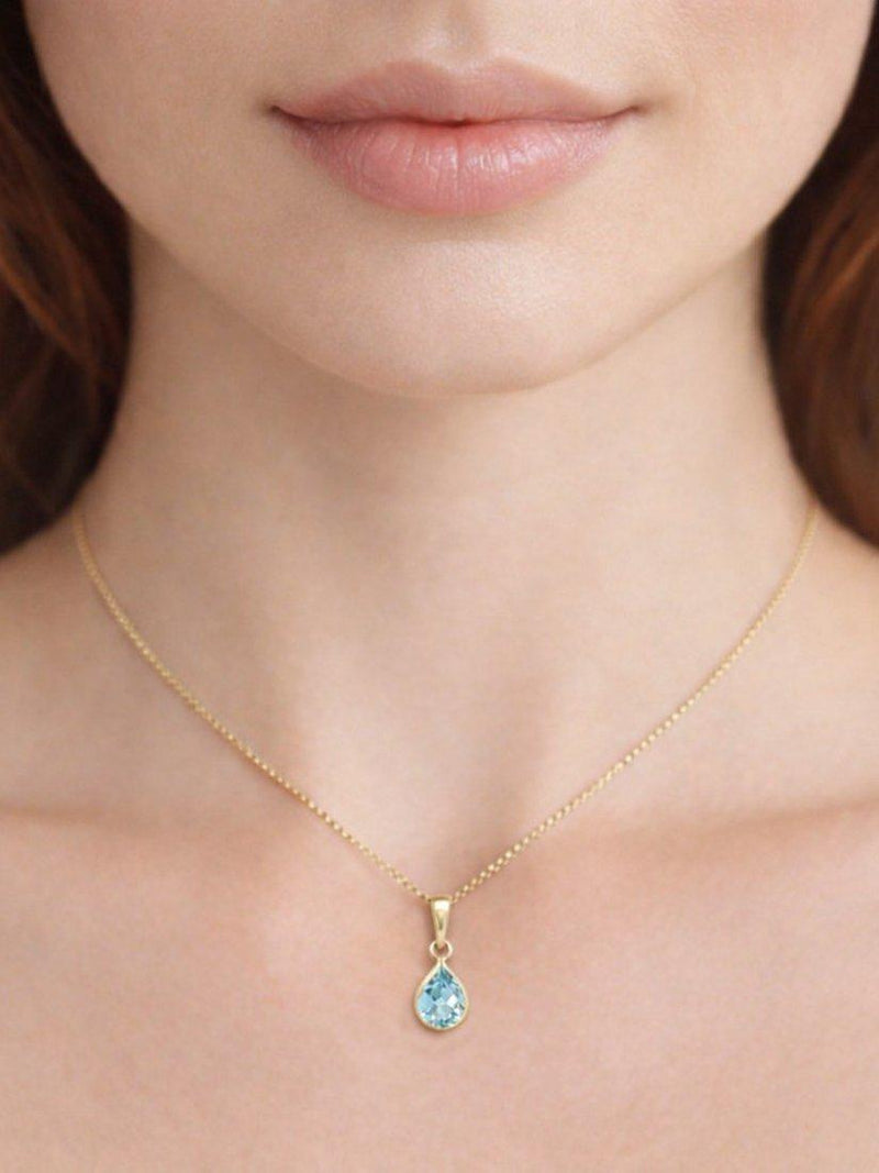 E.W Adams blue topaz pendant 9ct gold, imported from the UK
