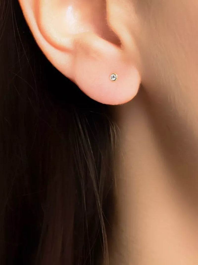 E.W Adams 9ct gold diamond stud earrings, UK version