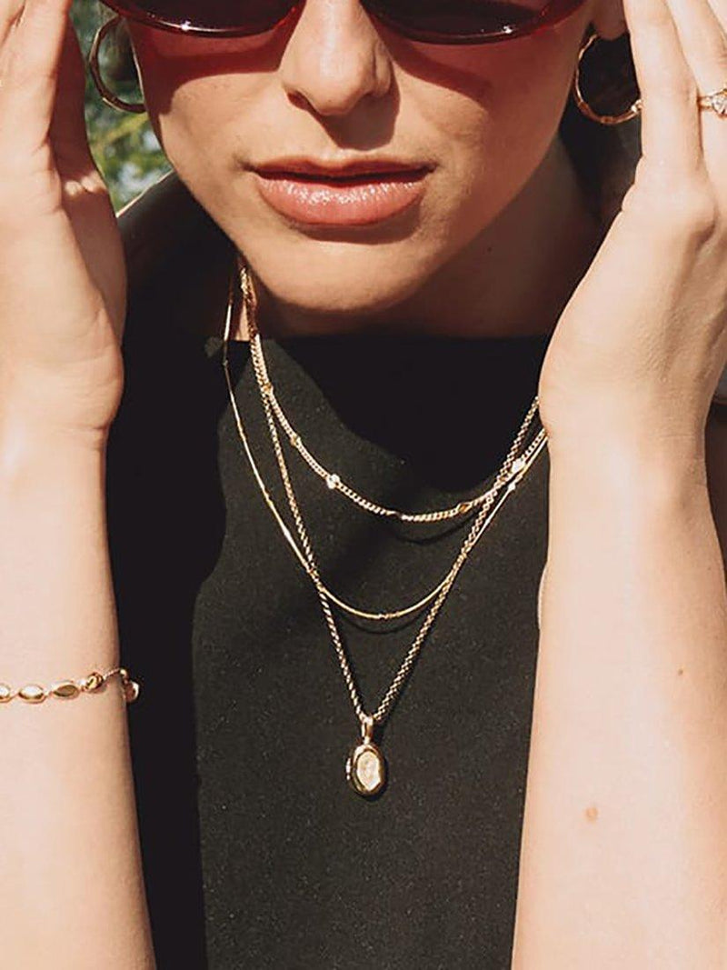 Daisy London gold locket necklace, lab-grown sapphire (British brand)