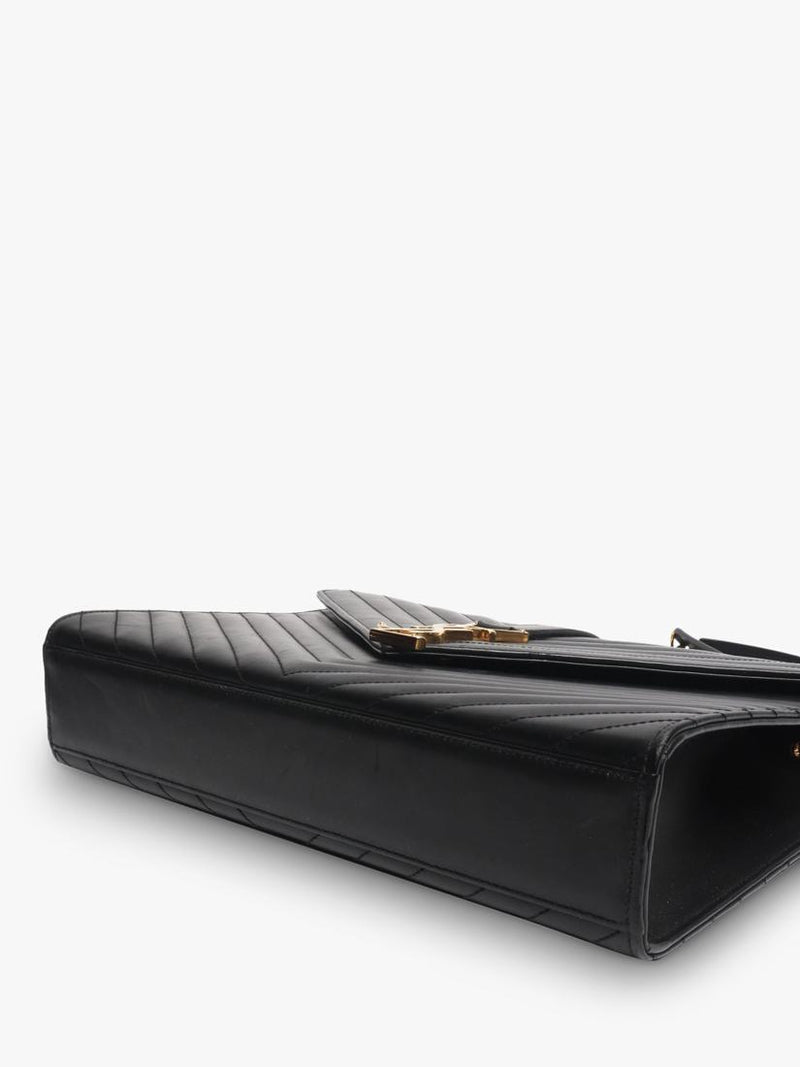Saint Laurent pre-loved leather envelope bag with gold hardware (British brand)