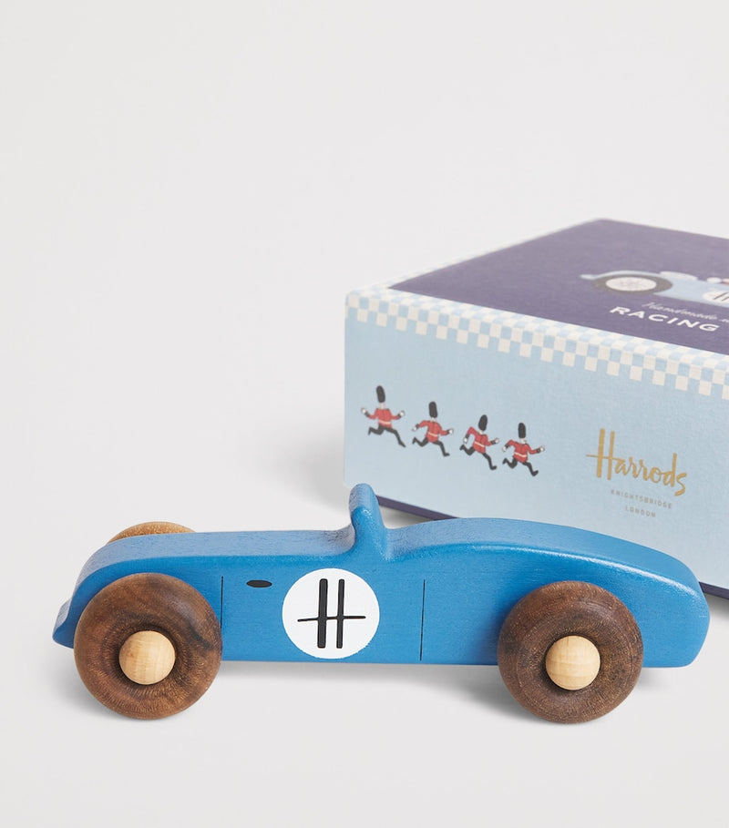 Harrods vintage-style wooden racing car toy with spinning wheels, UK version