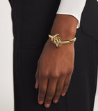 Engelbert yellow gold knot bangle with circular detailing - British product