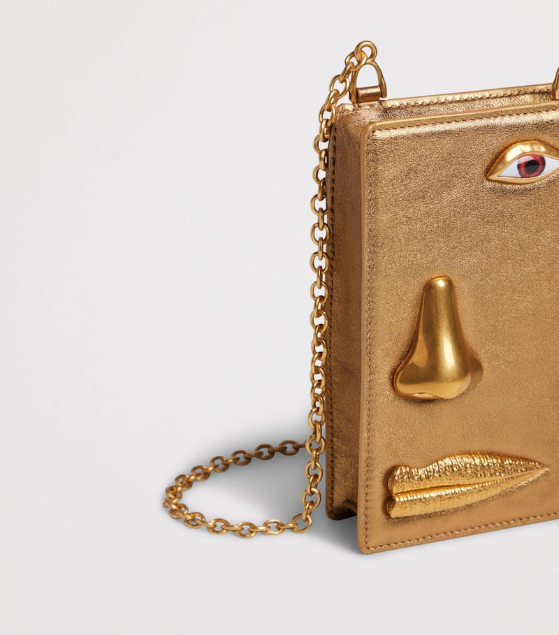 Schiaparelli leather face phone pouch, UK version