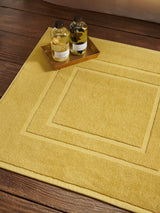 Next Christy Saffron Yellow Brixton 850GSM 100% Cotton Bath Mat- Buy online at McGrocer