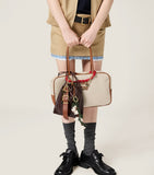 Miu Miu Beau top-handle bag in leather-canvas, UK version