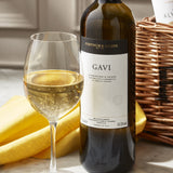 Wicker wine hamper with four assorted bottles, imported from the UK
