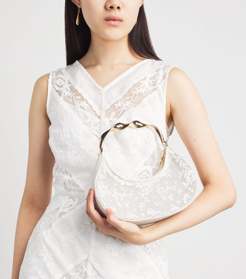 Simkhai Nixi embroidered mesh clutch bag, imported from the UK