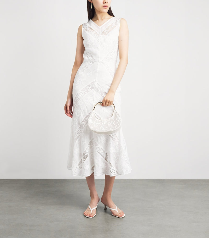 Simkhai Nixi embroidered mesh clutch bag, imported from the UK