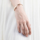 Radley rose gold plated jumping dog bangle (British brand)