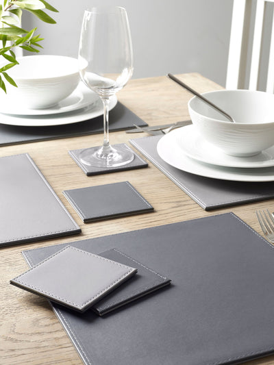 Next Charcoal Grey Reversible Faux Leather Placemats and Coasters Set of 4- Buy online at McGrocer