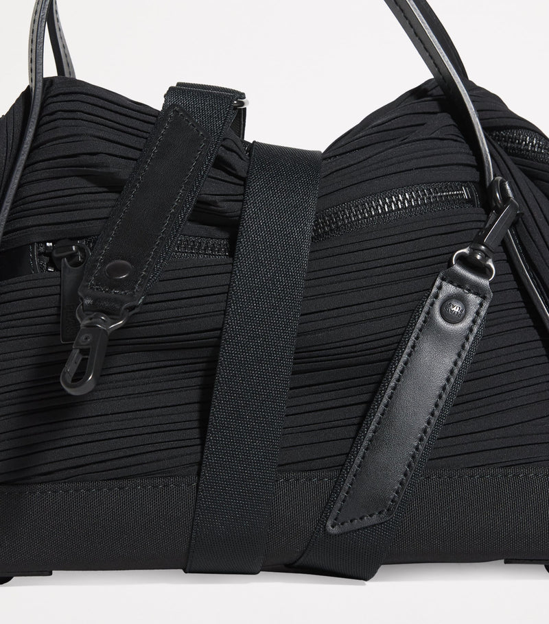 Pleats Please Issey Miyake mini bias pleats duffle bag, imported from the UK