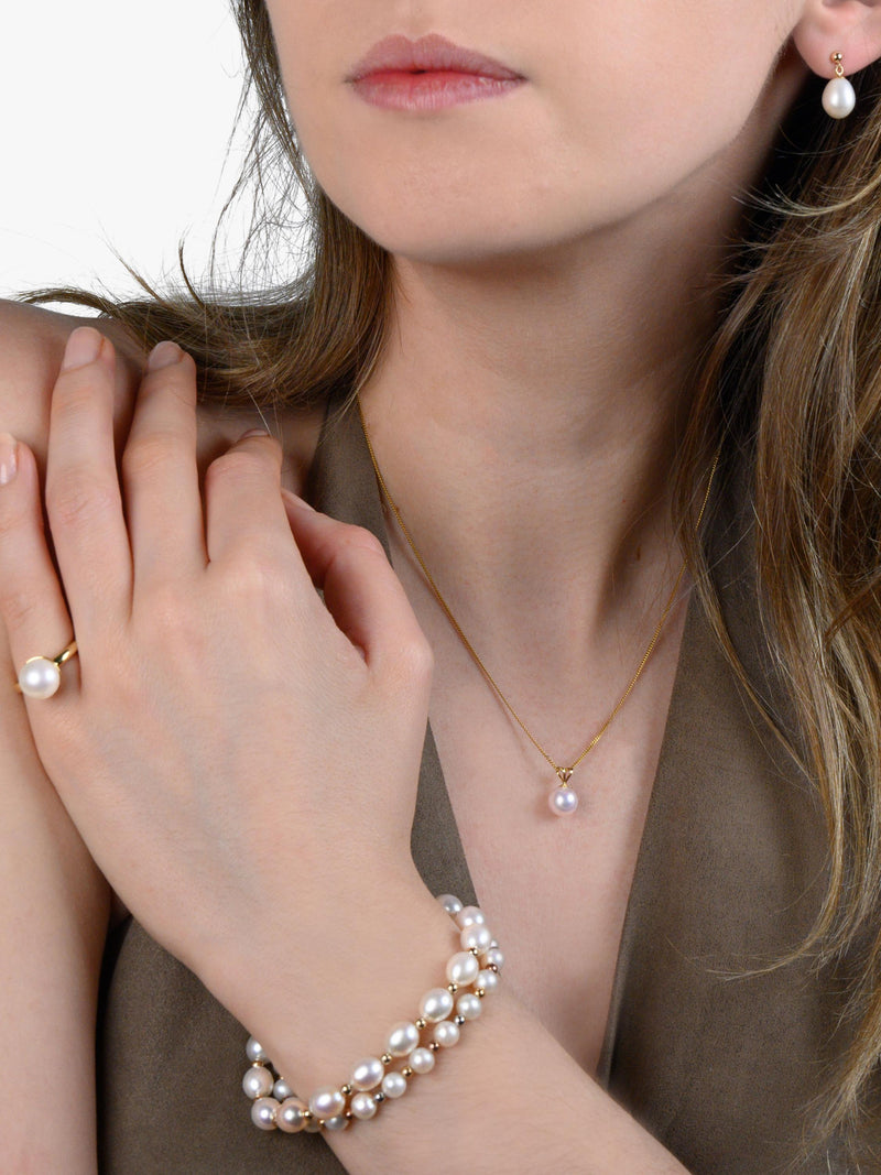 E.W Adams oval freshwater pearl bracelet with 9ct gold, imported from the UK