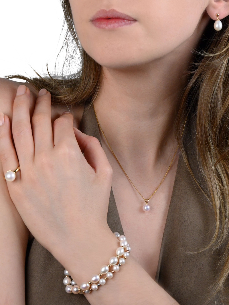 E.W Adams oval freshwater pearl bracelet with 9ct gold, imported from the UK