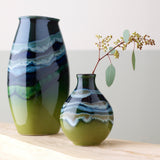 Poole Pottery green hourglass-shaped bud vase with 12cm height, imported from the UK