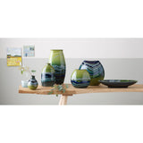 Poole Pottery green hourglass-shaped bud vase with 12cm height, imported from the UK